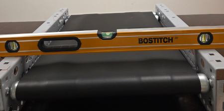 Flat belts walk if comveyor is not level